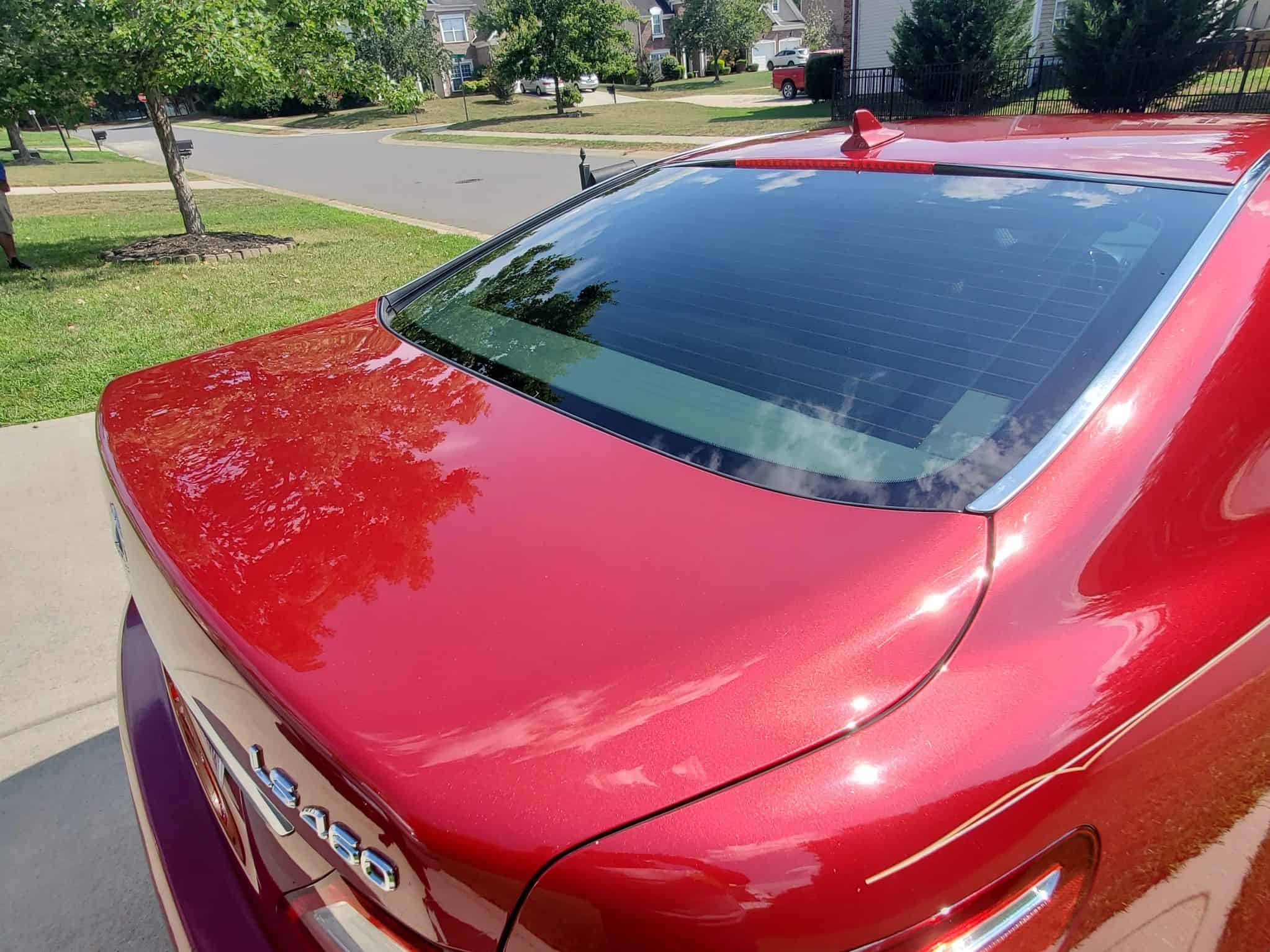 Red automobile rear window